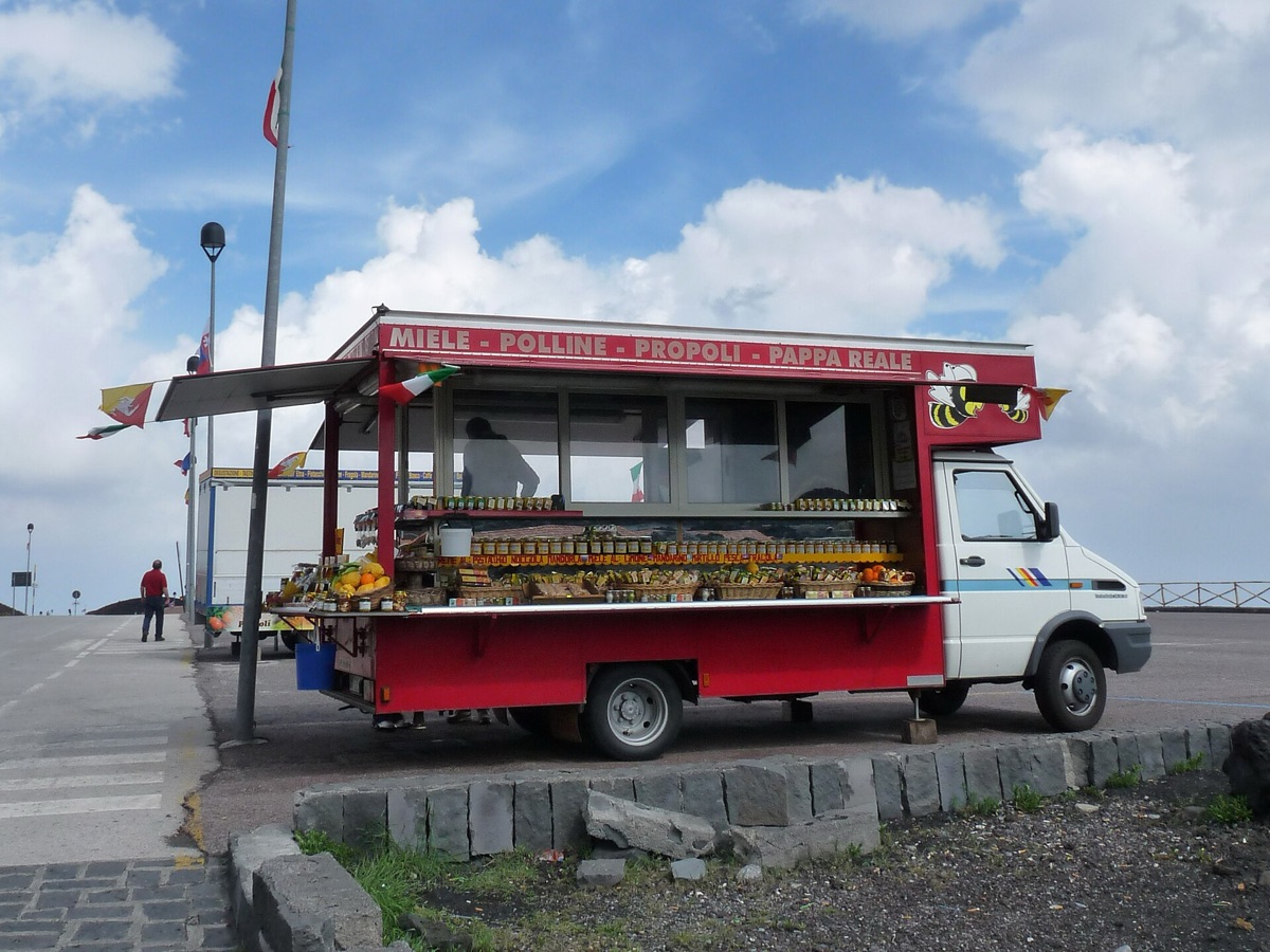 Italian street with food vendor, cultural place, social reaction